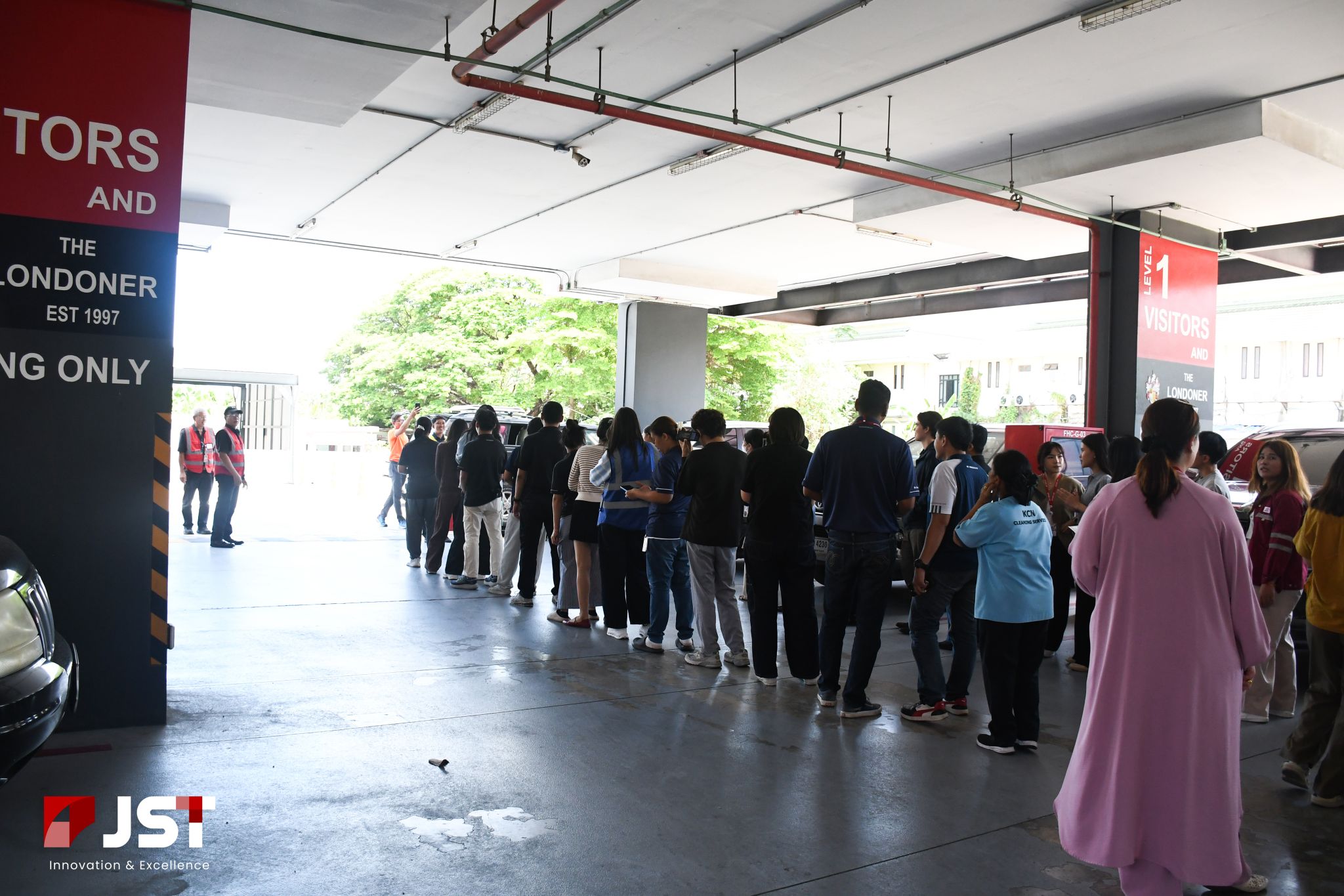 Employees gathered at the designated assembly point during JST Group's fire evacuation drill 2026