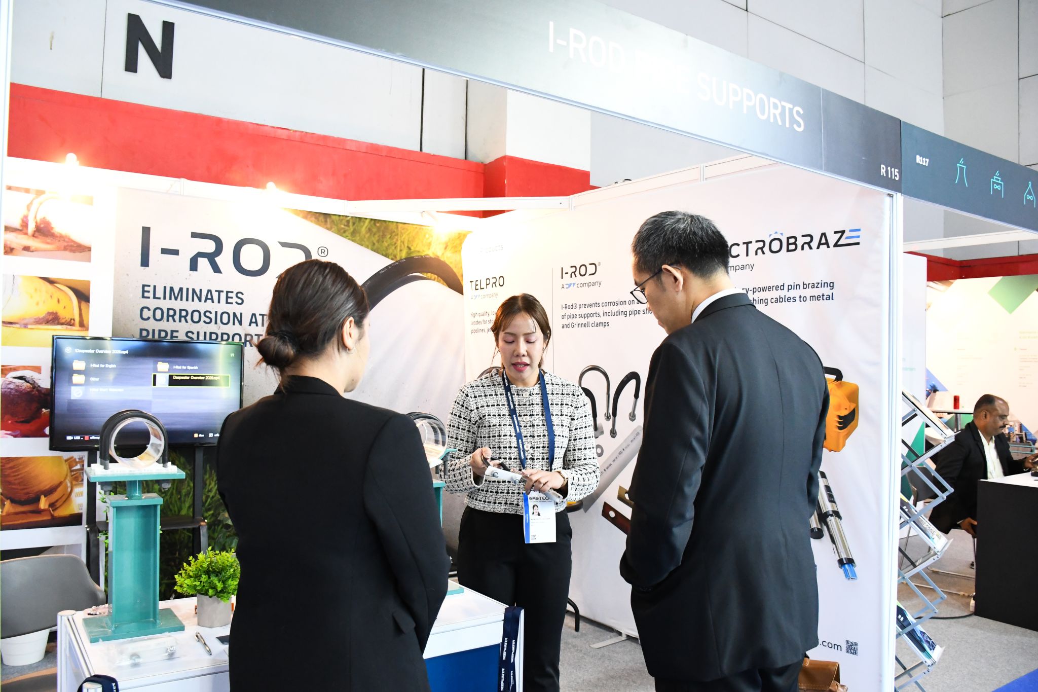 JST Group team member demonstrating an I-Rod pipe support sample to visitors at Gastech 2026 Bangkok