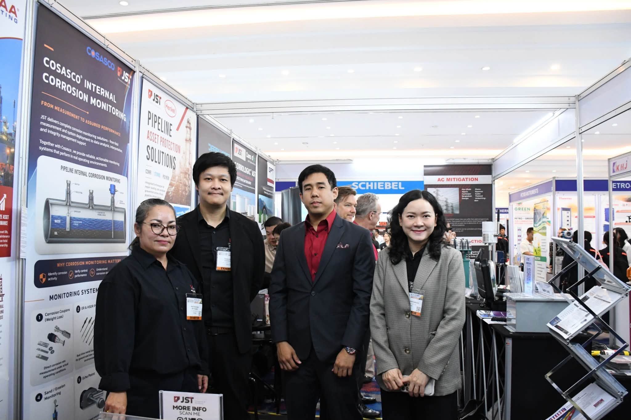 JST Group team at the Cosasco internal corrosion monitoring display