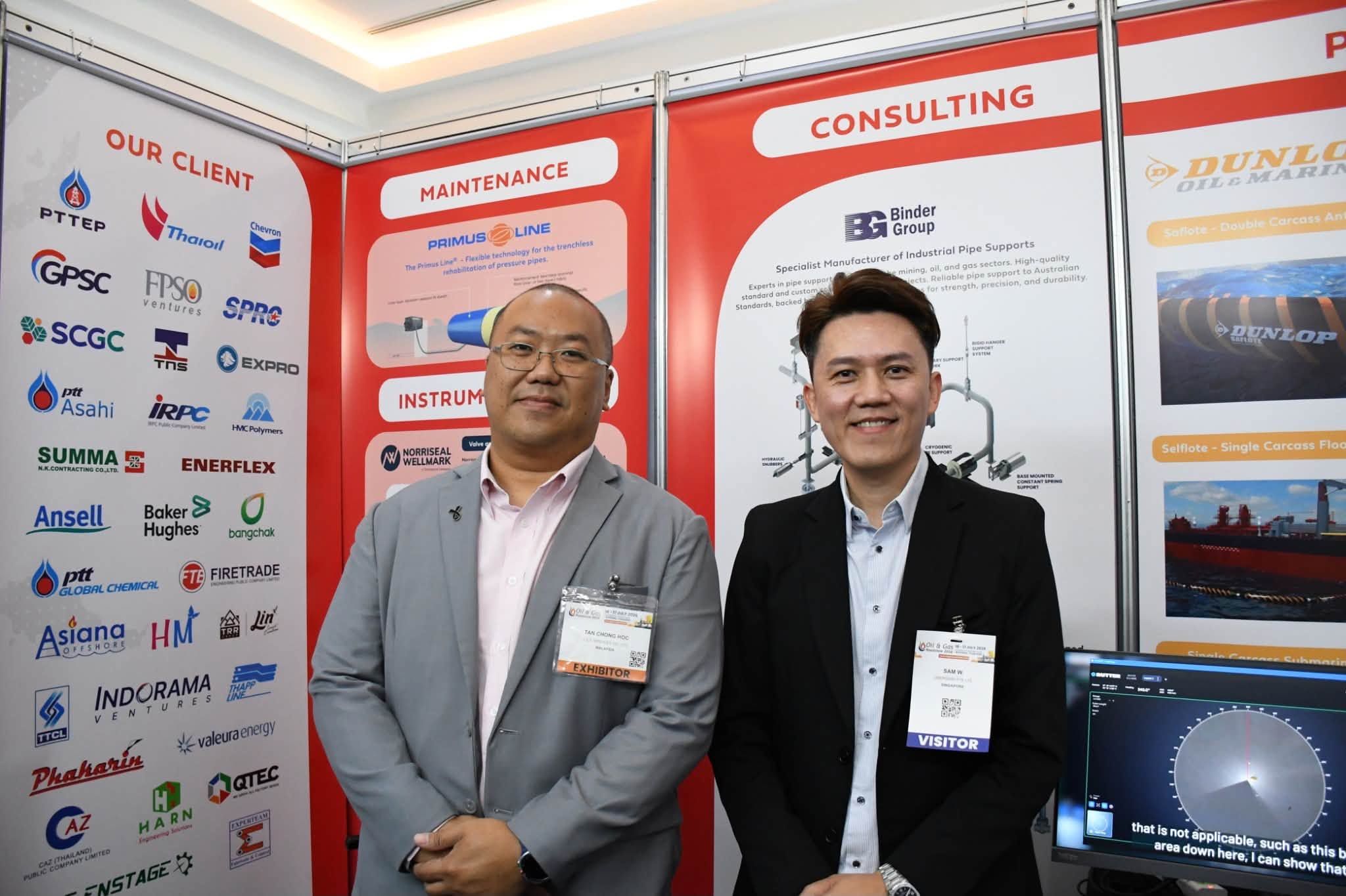 Visitors at the JST Group booth with Binder Group and Dunlop Oil & Marine displays